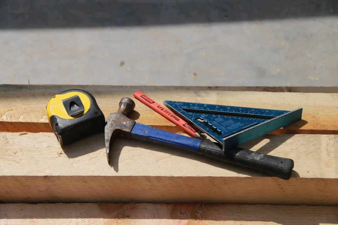 black and yellow claw hammer on Hammer & Home