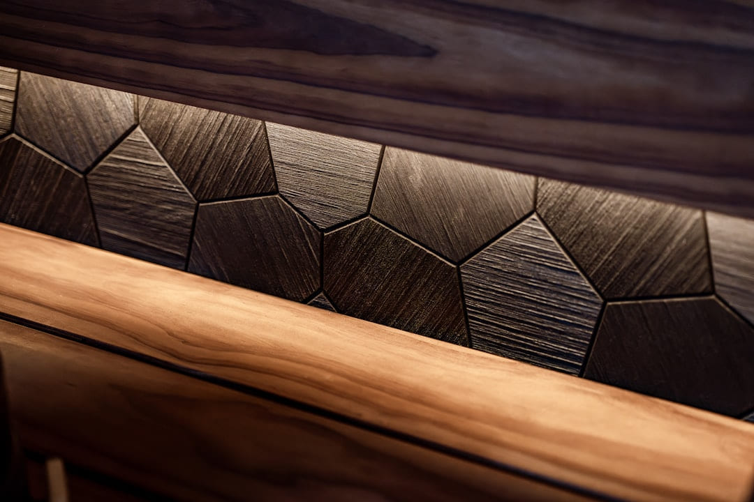 Textured wooden panels with subtle backlighting on Hammer & Home