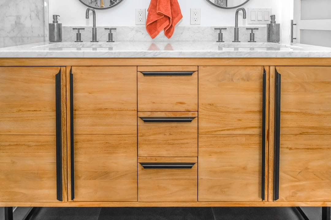 brown wooden cabinet with mirror on Hammer & Home