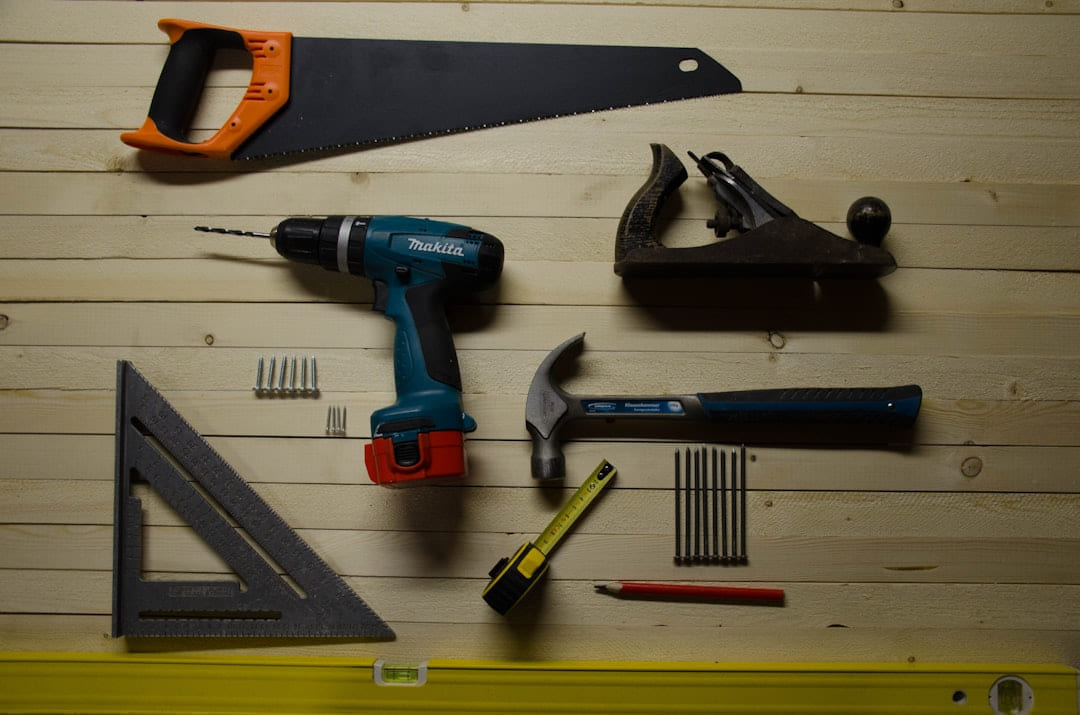 assorted-color handheld tools on Hammer & Home