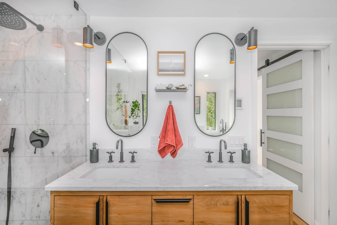 white ceramic sink with mirror on Hammer & Home