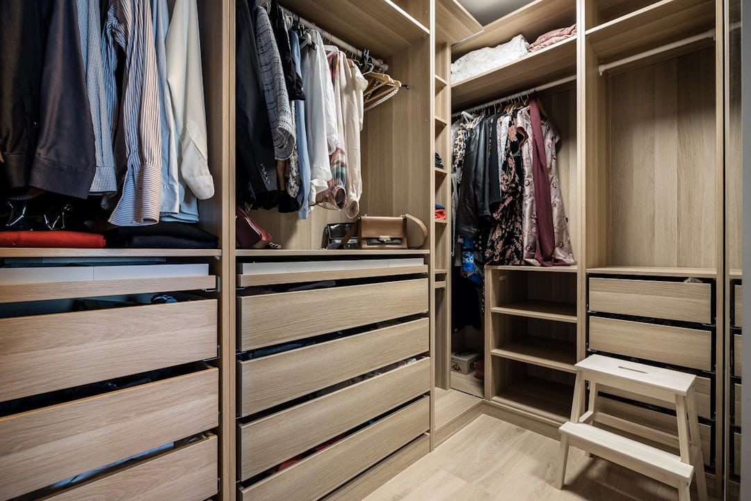 A walk in closet filled with lots of clothes on Hammer & Home
