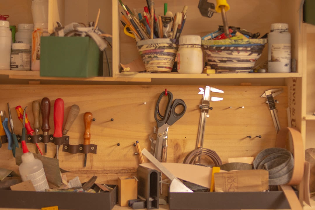 a wooden shelf filled with lots of tools on Hammer & Home